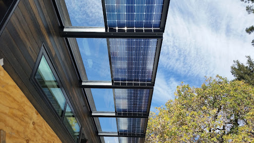 Transparent solar panels integrate seamlessly into surfaces like windows while allowing light to pass through, whereas bifacial solar panels capture sunlight from both their front and rear sides, enhancing energy production.
